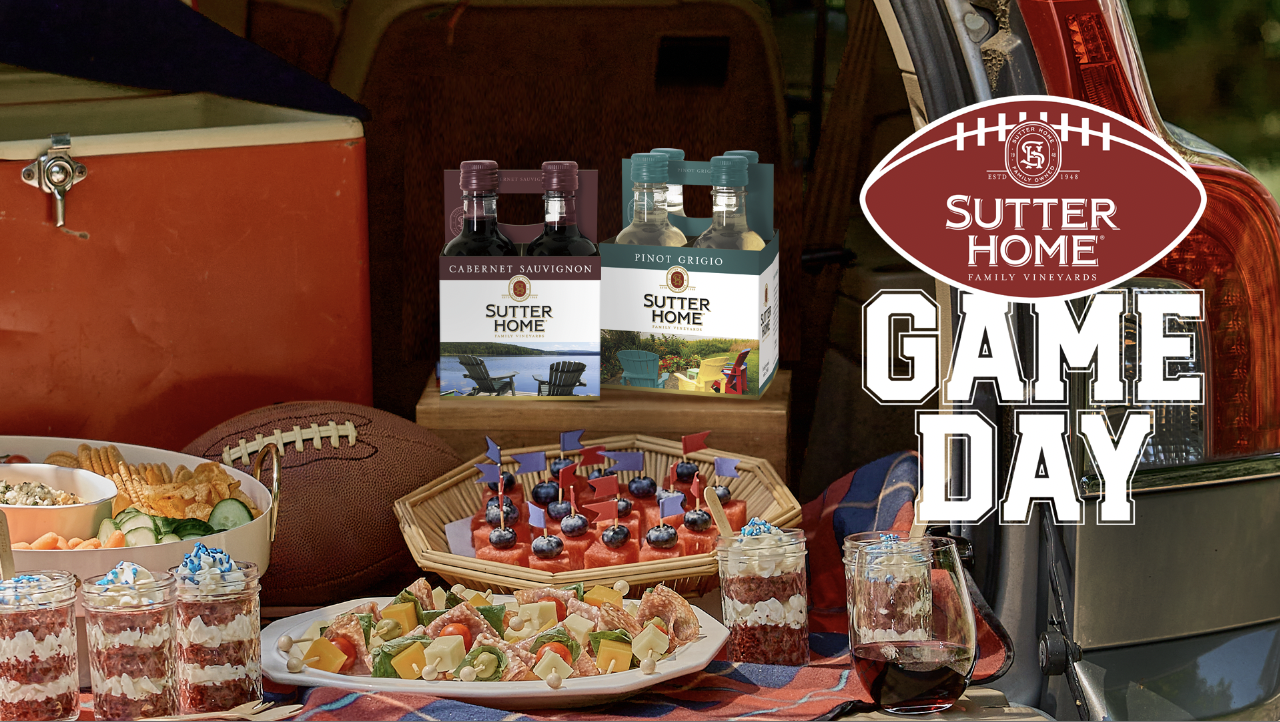 A hand holds bottle of Sutter Home chardonnay next to a black-colored griddle with a logo for the Sutter Home Build a Better Burger competition along with the words "Enter for a chance to win a Blackstone Griddle" and a button that reads "Enter Now"